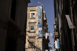 The blow-up of the Nigerian footballer and Napoli striker Victor Osimhen hangs on a building in the historic center of Naples, Southern Italy on April 20, 2023.