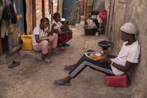 From left: Alima, 15 years old, Fatou, 17 years old, Fatou, 9 months old and Cherif, 20 years old are seen inside their house facing the sea in the “Langue de Barbarie” in Saint-Louis, Senegal on December 12, 2023. The “Langue de Barbarie” is a thin, sandy peninsula located in western Senegal, where around 80,000 people live and is among the places most threatened by the rise in sea levels generated by climate change. The peninsula separates the Atlantic ocean from the final section of the Senegal river.