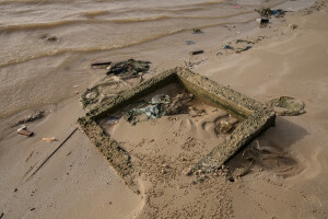 A water purifier covered in sand and water in the Doune Baba Dieye village in Saint-Louis, Senegal on December 12, 2023. Doune Baba Dieye was once a vibrant fishing community, but changing weather patterns and heavy rainfall in 2003 led to flooding inland and a rise in sea levels that have now submerged part of the village.