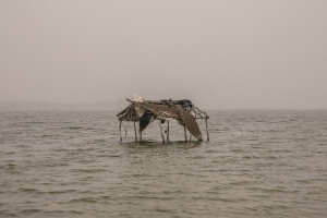 A hut, once a resting place for tourists, is submerged by the waters of Lac Rose (officially known as Lake Retba), a small naturalistic jewel located north-east of Dakar, Senegal on December 18, 2023. The environment of the lake is usually characterized by high salinity and the presence of unicellular algae called Dunaliella salina, which produce the characteristic reddish pigment. In recent months, however, torrential rains have pushed a large amount of water into the lake, tripling its usual depth and decreasing its salinity. The algae thus stopped producing colored pigments and the lake turned green. According to hydrologists, the continuous dilution with sediment-rich water could make both the salt and the microorganisms that make the lake pink disappear forever.